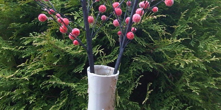 Natural slim vase with berries
