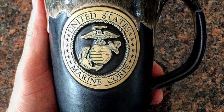 The elusive USMC coffee mug. Purported for years to exist in my home. Finally, I captured it. My wife...