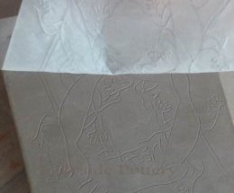applying design to leather hard clay